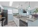 Charming kitchen features granite countertops, modern appliances, and bright lighting at 5722 Biscayne Ct # 308, New Port Richey, FL 34652