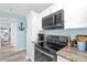 Well-equipped kitchen with modern appliances, granite counters, and ample cabinet space at 5722 Biscayne Ct # 308, New Port Richey, FL 34652