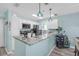 Modern kitchen with stainless steel appliances, granite countertops, and stylish pendant lighting at 5722 Biscayne Ct # 308, New Port Richey, FL 34652