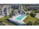 A community pool is surrounded by lush landscaping near the waterfront homes and docking facilities at 5722 Biscayne Ct # 308, New Port Richey, FL 34652