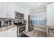 Kitchen featuring stainless steel appliances, granite countertops and plantation shutters at 6211 Sun Blvd # 206, St Petersburg, FL 33715