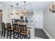 Charming kitchen with modern appliances, breakfast bar, granite countertops, and stylish pendant lighting at 6211 Sun Blvd # 206, St Petersburg, FL 33715