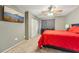 Bedroom with a large screen television, closet space, and a black dresser at 7224 E Bank Dr # 206, Tampa, FL 33617