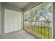 Screened porch with lake view, showcasing white storage closet at 7224 E Bank Dr # 206, Tampa, FL 33617