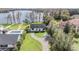 Aerial view of the property with a pool, lush greenery, and waterfront access at 7730 N Mobley Rd, Odessa, FL 33556