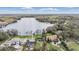 Scenic aerial view of a lakeside community, highlighting beautiful homes and water access at 7730 N Mobley Rd, Odessa, FL 33556