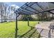 Backyard featuring a pergola overlooking the lake at 7730 N Mobley Rd, Odessa, FL 33556