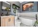 Well-decorated bathroom showcasing a freestanding tub, modern vanity, and stylish decor, providing a luxurious experience at 7730 N Mobley Rd, Odessa, FL 33556