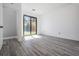 Bright bedroom with a sliding glass door at 7730 N Mobley Rd, Odessa, FL 33556