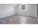 This bright bedroom has hard surface floors and large window at 7730 N Mobley Rd, Odessa, FL 33556