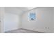 A bright bedroom with hard surface floors and a large window at 7730 N Mobley Rd, Odessa, FL 33556