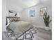 Comfortable bedroom featuring neutral decor, a window with natural light, and a plant, creating a peaceful sanctuary at 7730 N Mobley Rd, Odessa, FL 33556
