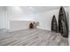 Spacious bonus room with light gray flooring and unique boat-shaped shelving providing a cozy and functional living area at 7730 N Mobley Rd, Odessa, FL 33556