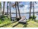 Waterfront backyard featuring a wooden dock and beautiful lake views at 7730 N Mobley Rd, Odessa, FL 33556