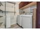 This laundry room has overhead cabinets and hanging racks at 7730 N Mobley Rd, Odessa, FL 33556