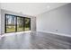 Spacious living room with a view of the lake and a sliding glass door at 7730 N Mobley Rd, Odessa, FL 33556