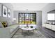 Staged living room showcasing stylish decor and a large sliding glass door at 7730 N Mobley Rd, Odessa, FL 33556
