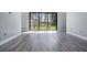 Living space with sliding glass doors that view the lake at 7730 N Mobley Rd, Odessa, FL 33556