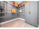 Spacious walk-in closet with wire shelving and a gray cabinet, offering ample storage space for clothes and accessories at 7730 N Mobley Rd, Odessa, FL 33556