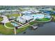 Aerial view of the community featuring a pool, clubhouse, and lake at 8435 Ocean Tides Cv, Parrish, FL 34219