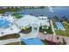 Beautiful clubhouse near a lake offering a bocce ball court and convenient golf cart parking at 8435 Ocean Tides Cv, Parrish, FL 34219