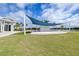 Community stage and lawn area next to the Sarasota grille and lake at 8435 Ocean Tides Cv, Parrish, FL 34219