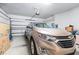 Spacious two car garage featuring a modern door opener and ample storage space and an Equinox car at 8435 Ocean Tides Cv, Parrish, FL 34219