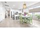 Open kitchen with central island, breakfast nook, and seamless transition to the hallway at 8435 Ocean Tides Cv, Parrish, FL 34219