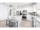 Bright kitchen with a center island, stainless steel appliances, and modern white cabinetry at 8435 Ocean Tides Cv, Parrish, FL 34219