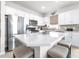 Beautiful kitchen featuring a spacious island with seating, perfect for casual dining and entertaining at 8435 Ocean Tides Cv, Parrish, FL 34219