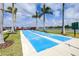 Shuffleboard courts near the lake, surrounded by palm trees in this community at 8435 Ocean Tides Cv, Parrish, FL 34219