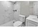This modern bathroom has white marble tile in the shower and on the floors at 8640 Tahoe Ct # 16, Tampa, FL 33614