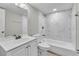 Bright bathroom featuring a shower with marble tiling, a tub, and a modern vanity at 8640 Tahoe Ct # 16, Tampa, FL 33614