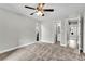 A serene bedroom with neutral walls, carpet flooring, a window with a view, and an ensuite bathroom at 8640 Tahoe Ct # 16, Tampa, FL 33614