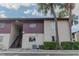 Exterior shot of building featuring muted color scheme and stairs to upper units at 8640 Tahoe Ct # 16, Tampa, FL 33614