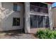 Exterior view showcasing the building's architecture, including a screened lanai with tropical landscaping at 8640 Tahoe Ct # 16, Tampa, FL 33614