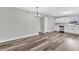 Open-concept living room and kitchen with modern finishes, hardwood floor and stainless steel appliances at 8640 Tahoe Ct # 16, Tampa, FL 33614