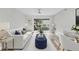 Bright living room with modern furnishings, neutral color palette, and sliding doors leading to an outdoor patio at 8640 Tahoe Ct # 16, Tampa, FL 33614