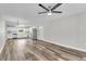 Bright, open-concept living room and kitchen with stainless steel appliances, wood floors, and recessed lighting at 8640 Tahoe Ct # 16, Tampa, FL 33614
