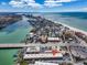Stunning aerial view of the coastal community with picturesque waterfront and vibrant cityscape, showcasing a desirable location at 9715 Harrell Ave # 22, Treasure Island, FL 33706