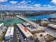 Aerial view of the condo and surrounding area with a vibrant cityscape, waterways and nearby marina at 9715 Harrell Ave # 22, Treasure Island, FL 33706