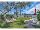 Beautiful backyard featuring a fire pit, picnic tables, and access to the waterfront at 9715 Harrell Ave # 22, Treasure Island, FL 33706
