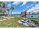 Relaxing outdoor seating by the water, complete with picnic tables and barbecue grill at 9715 Harrell Ave # 22, Treasure Island, FL 33706