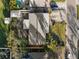 Aerial view of the home showcasing the roof, driveway, and surrounding landscaping at 1015 55Th S Ave, St Petersburg, FL 33705