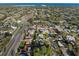 An aerial view displays a vibrant residential area with green trees and multiple roadways at 1015 55Th S Ave, St Petersburg, FL 33705