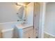 Well-lit bathroom featuring a toilet, vanity with drawers and cabinet, mirror, and lighting fixture at 1015 55Th S Ave, St Petersburg, FL 33705