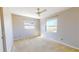 Bedroom featuring neutral walls, carpeted floors, a ceiling fan, and natural light from two windows at 1015 55Th S Ave, St Petersburg, FL 33705