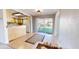 Bright dining area with sliding glass doors to the backyard and an open view of the kitchen with wood cabinets at 1015 55Th S Ave, St Petersburg, FL 33705