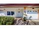 Inviting front exterior featuring a brick walkway, white picket fence, and an attached garage with decorative details at 1015 55Th S Ave, St Petersburg, FL 33705