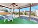 Covered patio featuring artificial turf and outdoor seating, great for relaxing at 1015 55Th S Ave, St Petersburg, FL 33705